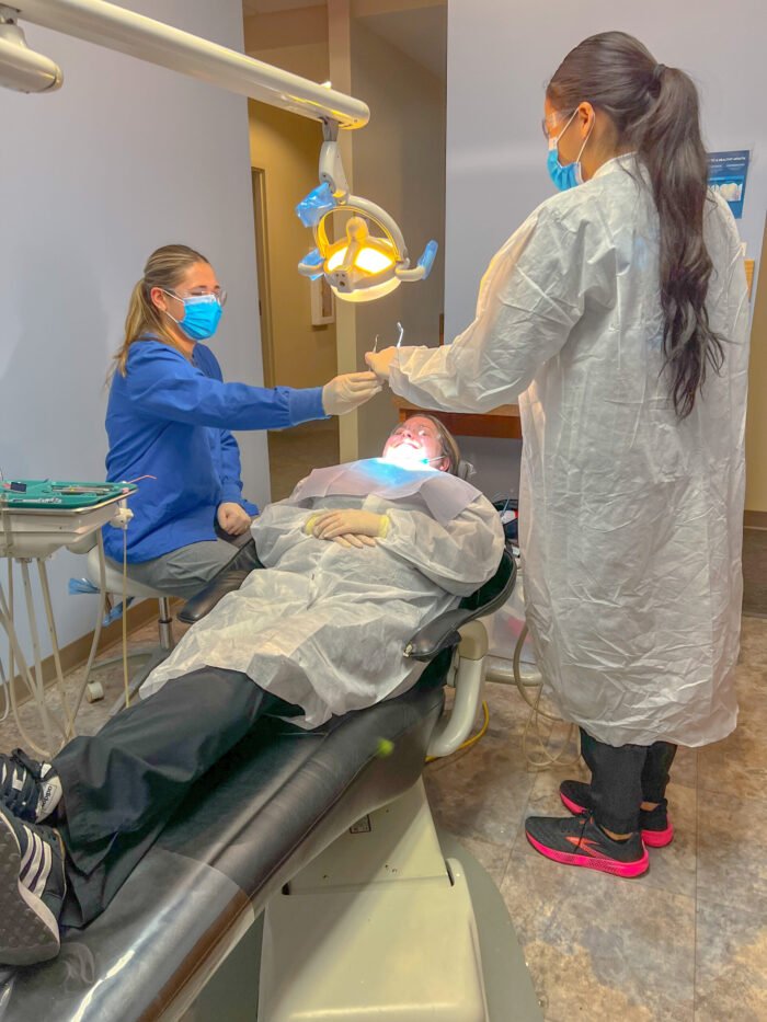 Dental Assistants transferring instrument